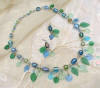 Image of jewlery glass leaves and beads antique looking