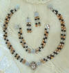 Image of jewlery scarab gold toned pearls and silver 