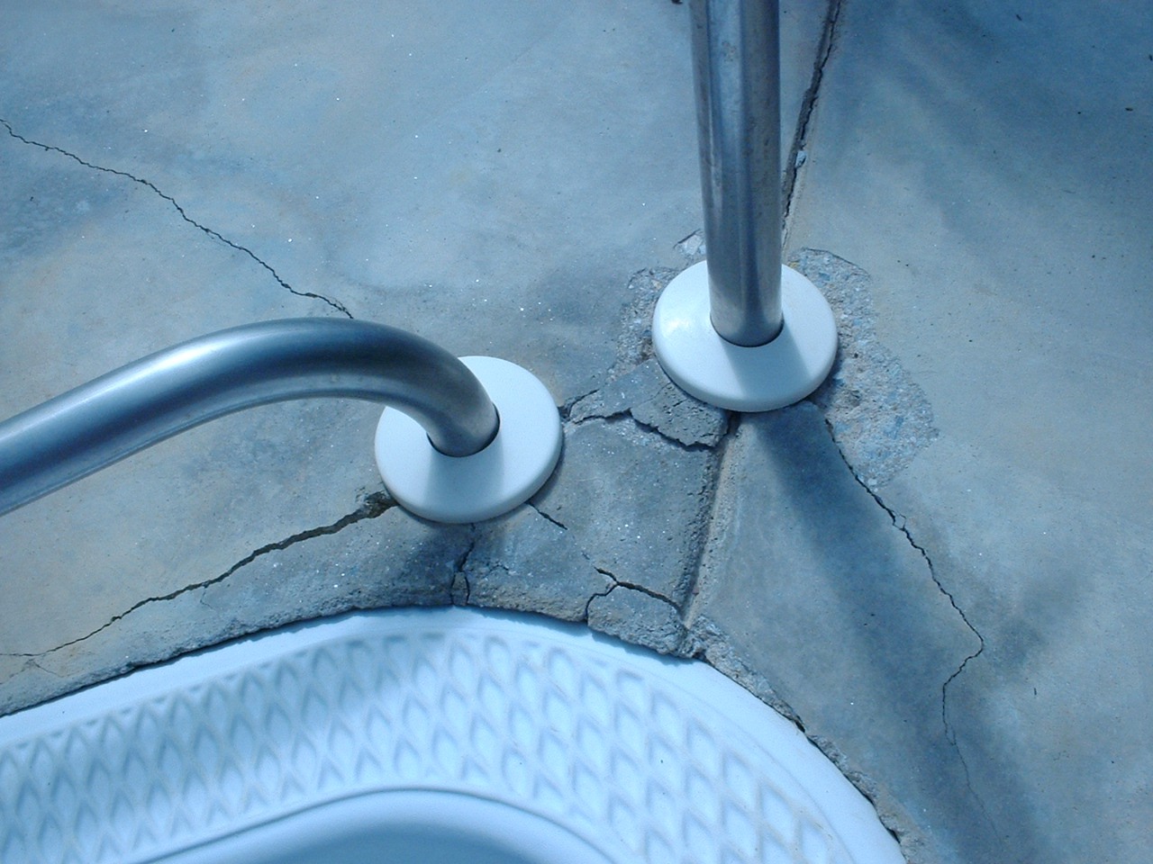 My pool steps cement concrete cracking and steps crooked loosing the decking around my pool due to cracks and the cement failing and eroding away.
